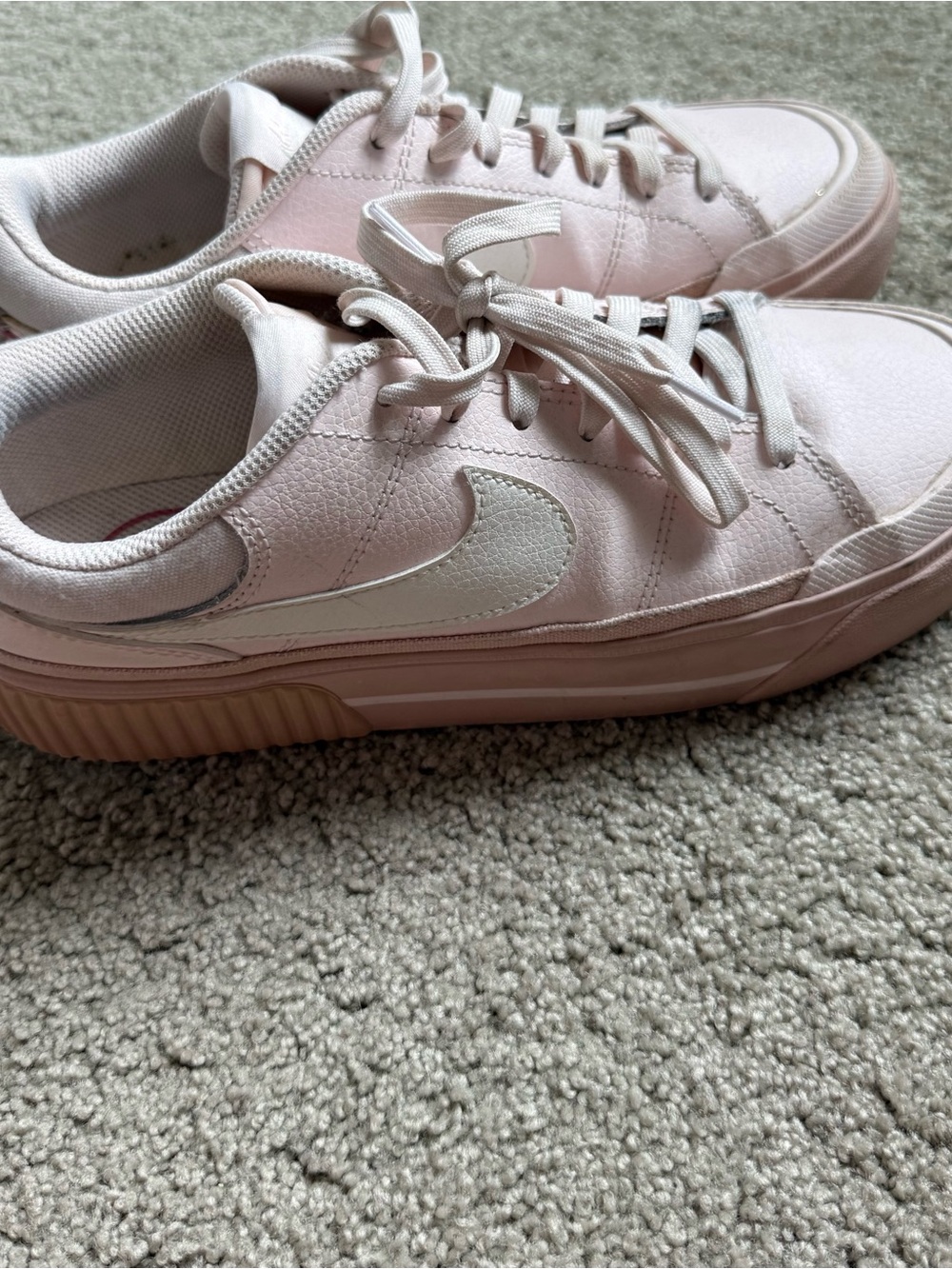 Nike Women’s Light Pink Low-Top Sneakers with White Swoosh